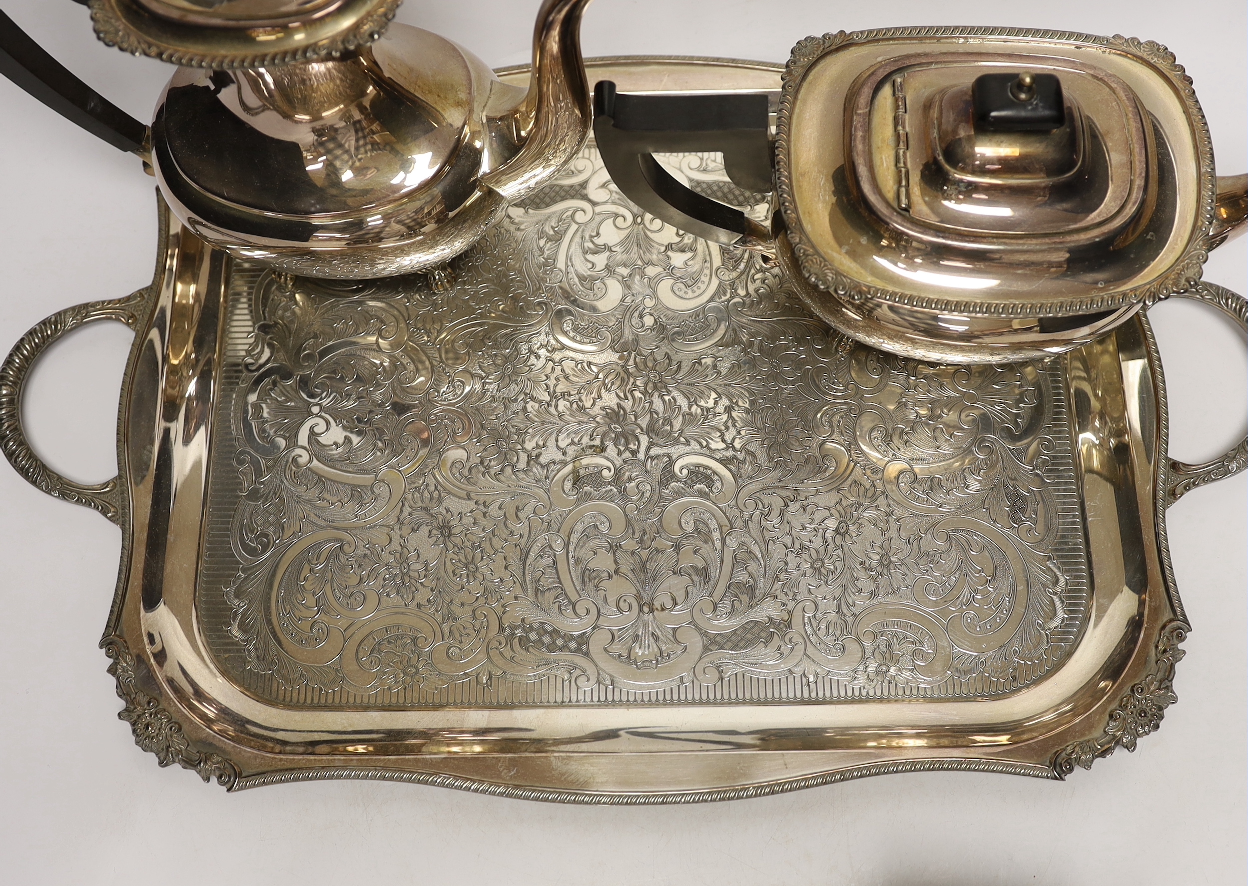 A plated tea / coffee set with ebonised handles and two Sterling condiment sets